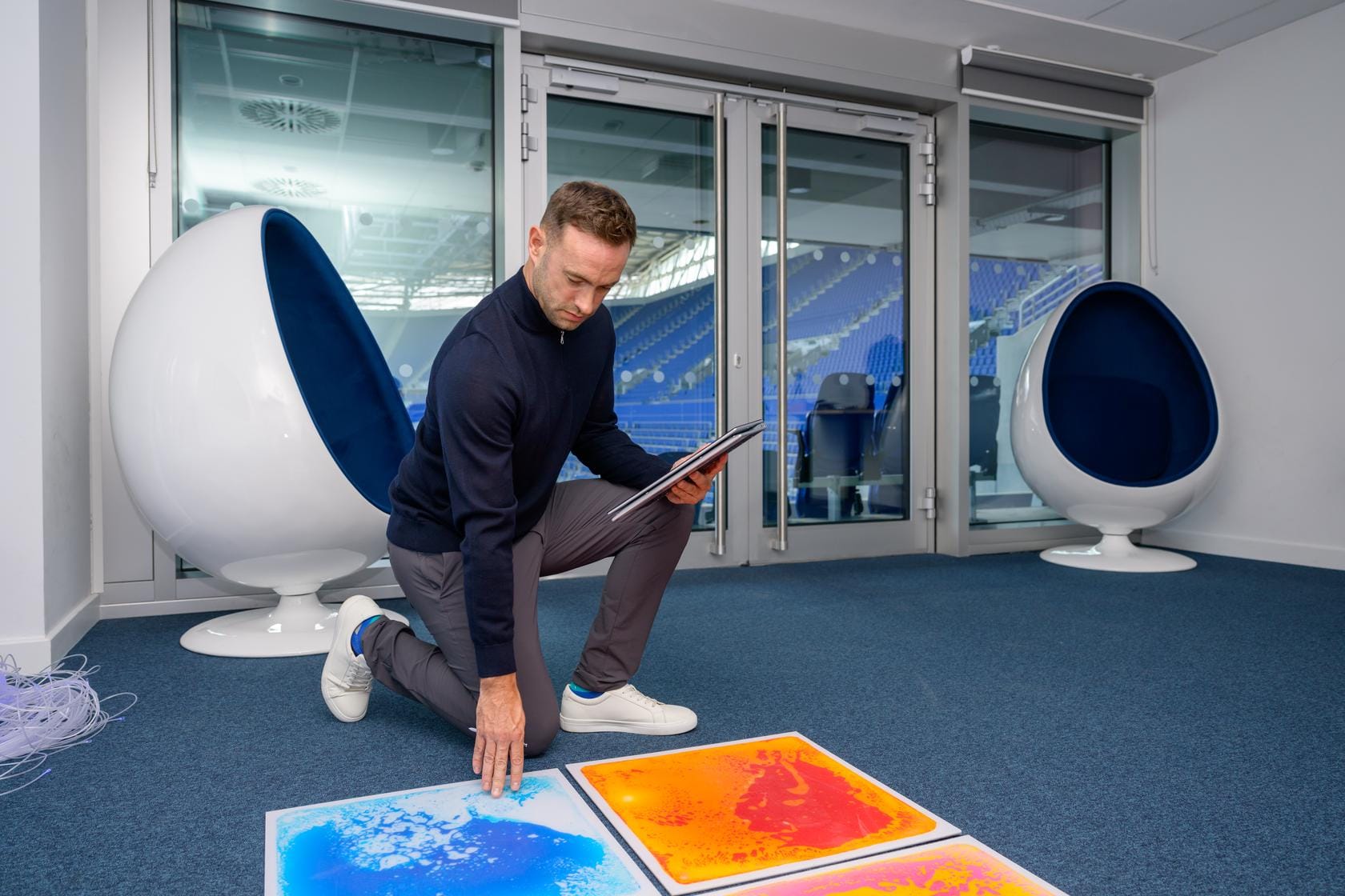 A Zensory assessor tests a tactile floor panel in the sensory room