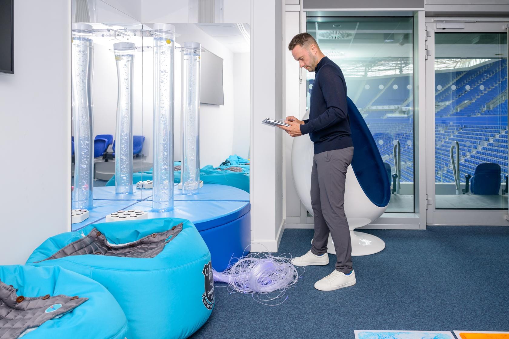 A Zensory assessor documents sensory equipment inside the stadium