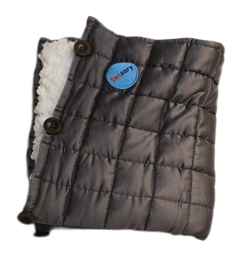 Folded Zensory weighted lap pad showing its quilted construction, buttons and tactile layer